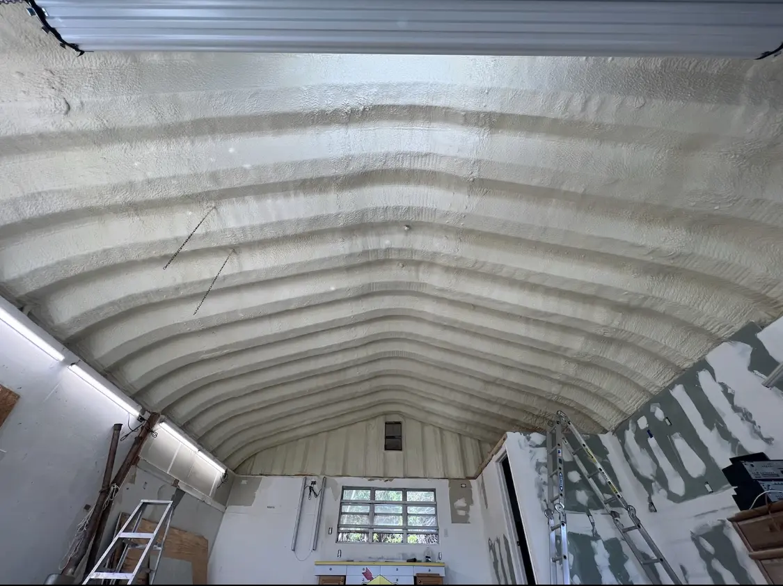 Spray polyurethane foam applied to the underside of a metal roof deck in Portsmouth